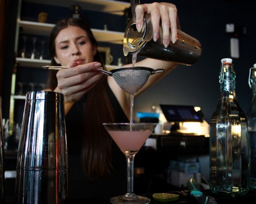 Mindi Making a Drink in the Cocktail Lounge